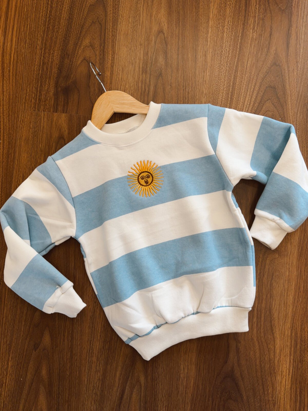 BUZO SOL DE MAYO NIÑO CELESTE