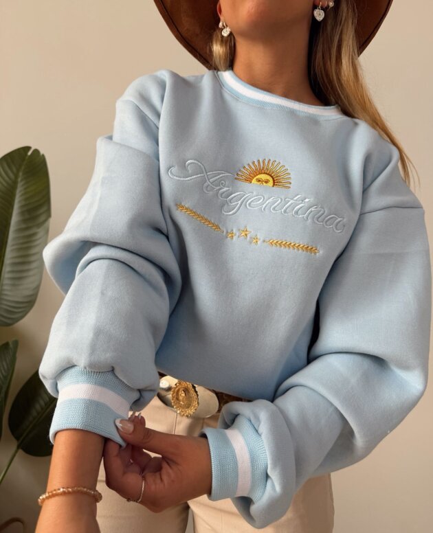 BUZO ARGENTINA PUÑOS FRISA CELESTE