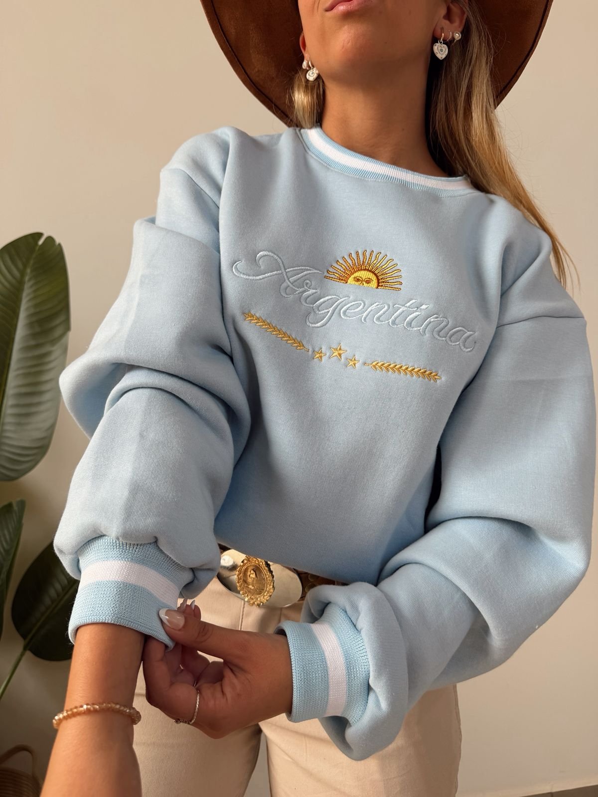 BUZO ARGENTINA PUÑOS FRISA CELESTE